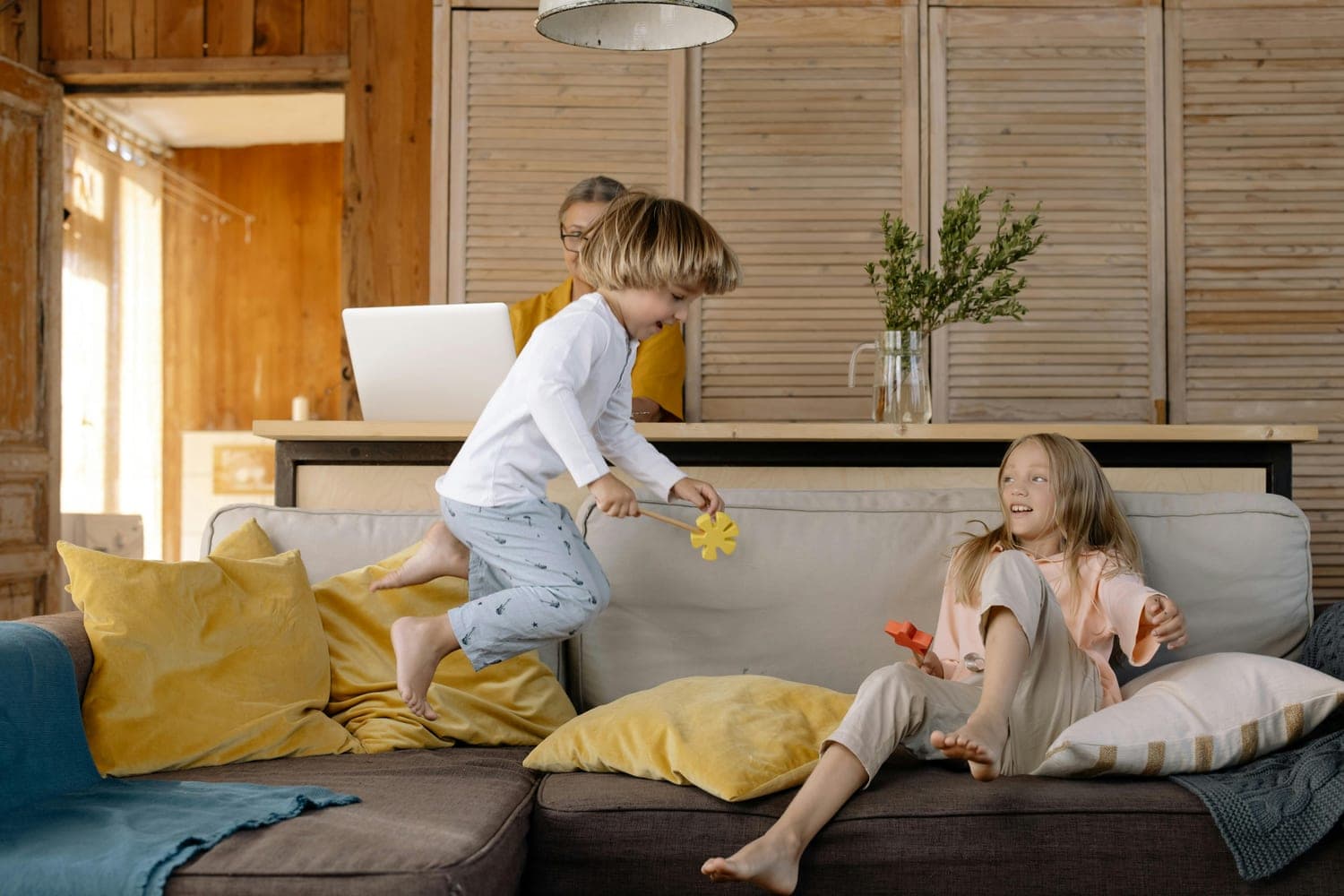 Person using the Hive app at home