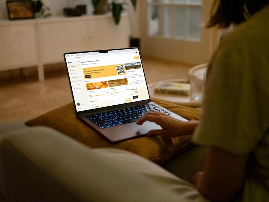 Person reviewing their Hive dashboard on a laptop at home
