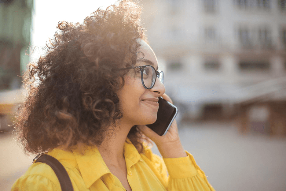 Young woman talking on phone and smiling