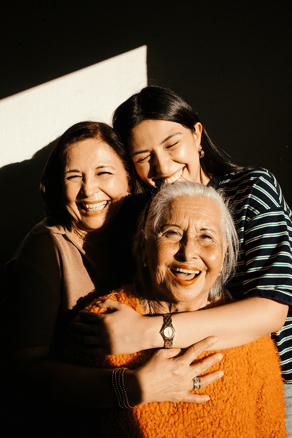 Three generations of women laughing